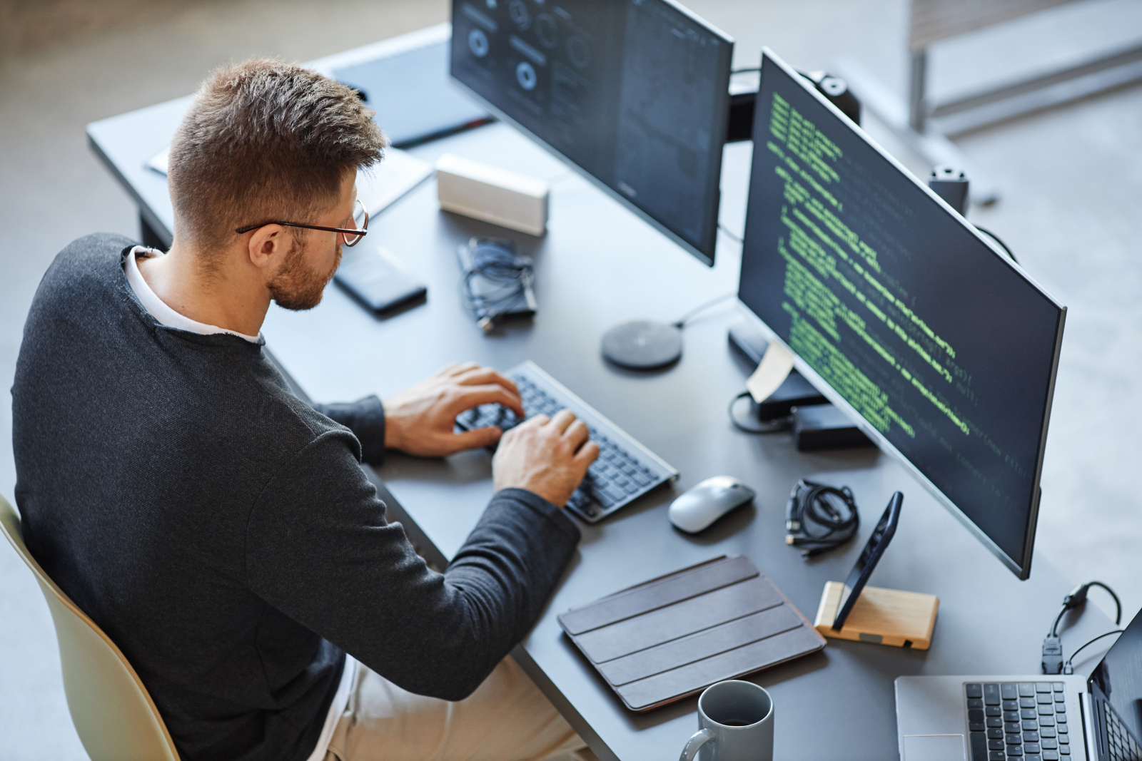 high-angle-view-software-developer-writing-code-while-using-computer-data-systems-office.jpg high-angle-view-software-developer-writing-code-while-using-computer-data-systems-office.jpg